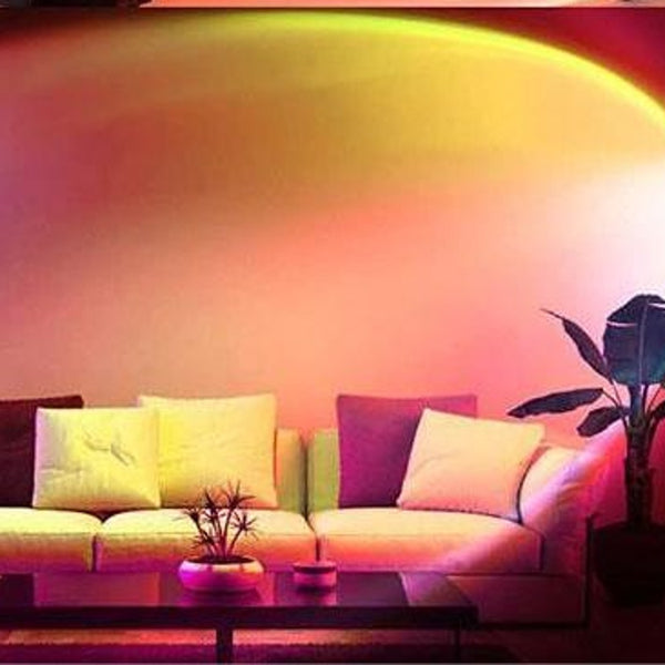 NOVU Sole sunset projection lamp casting a warm sunset glow in a cozy living room